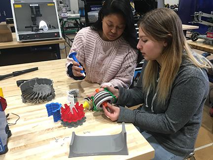 pre-engineering students working with gears