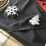 Image: small metal tree and snowflake cutouts